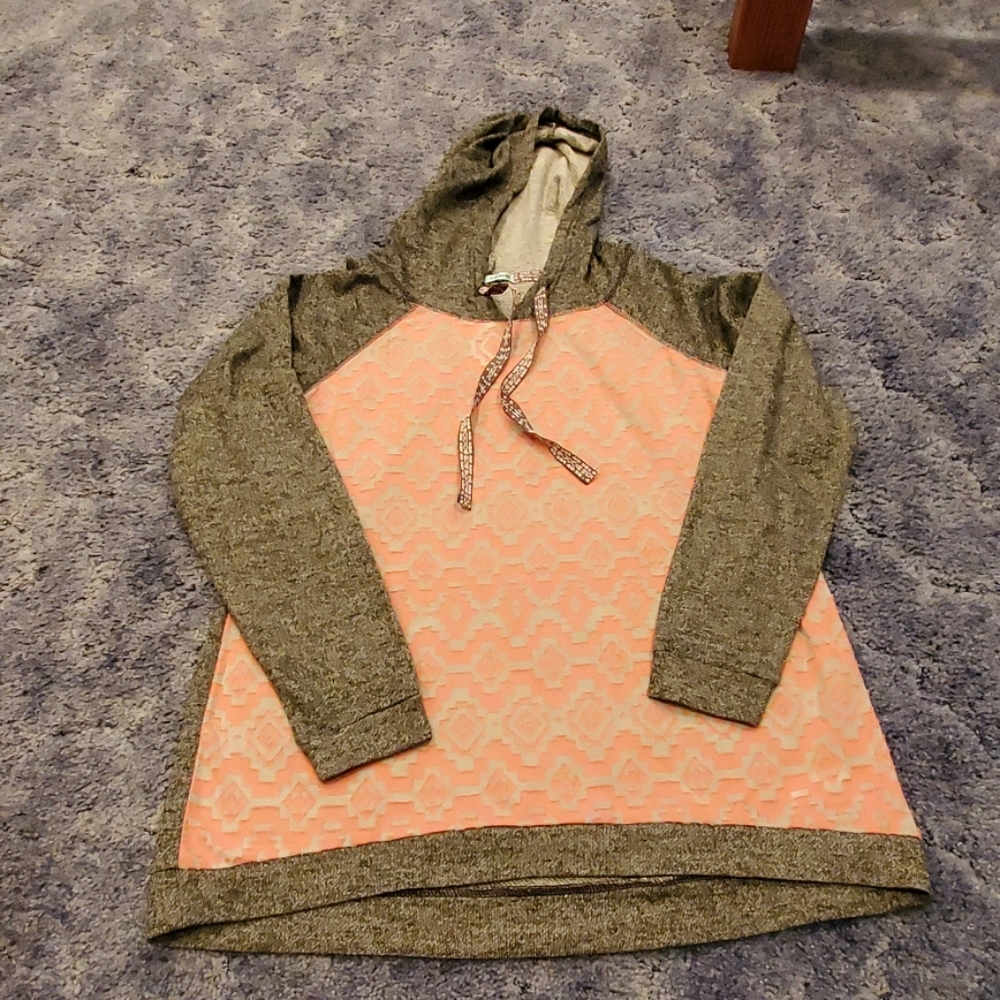 Gray and peach colored sweat shirt